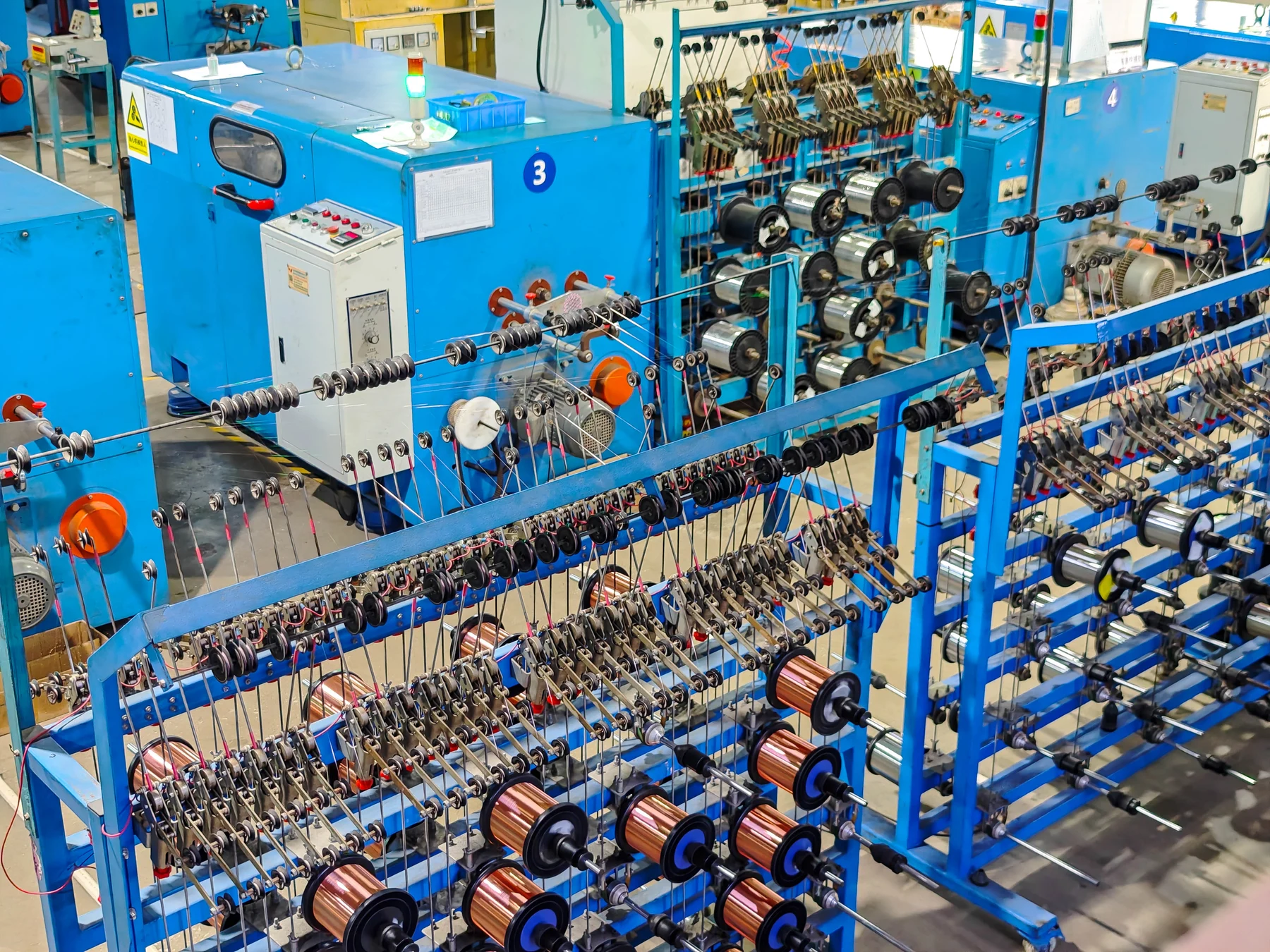 Wire pay-off racks at ANYANG cable manufacturing base
