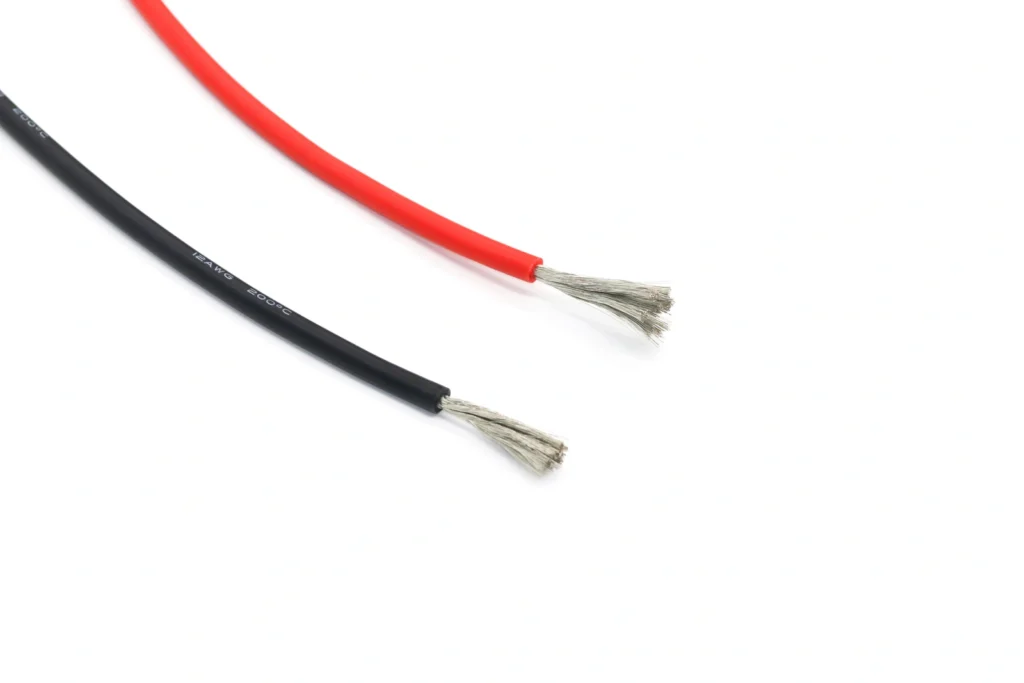 Red and black silicone wire samples with exposed fine strands; the black wire is marked 12 AWG.