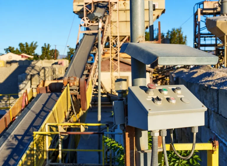 Control panel beside an aggregate conveyor