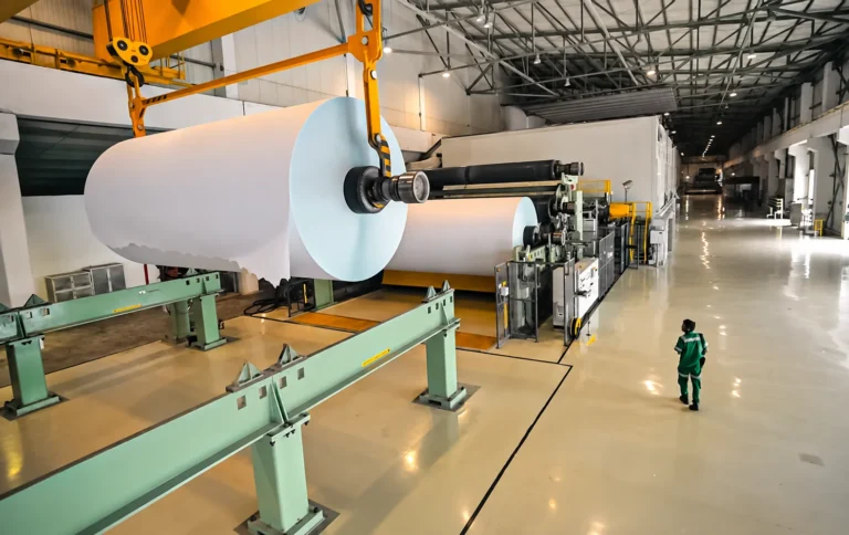 Large paper rolls inside a paper production hall