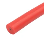 Cut face of a red thick-insulation silicone wire, with the conductor visible in the centre.