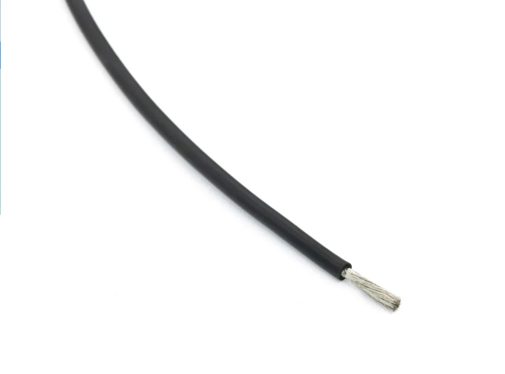 Black silicone wire sample with its stripped conductor visible.