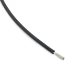 Black silicone wire sample with its stripped conductor visible.