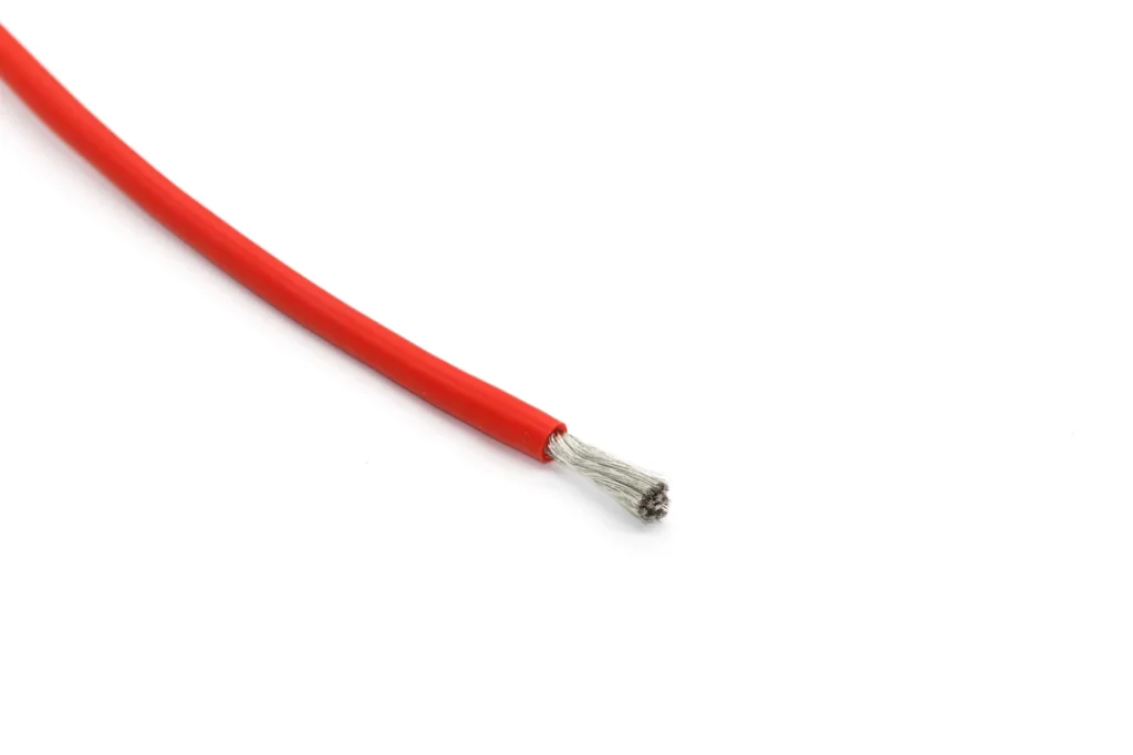 Red silicone wire sample with a short stripped conductor end.