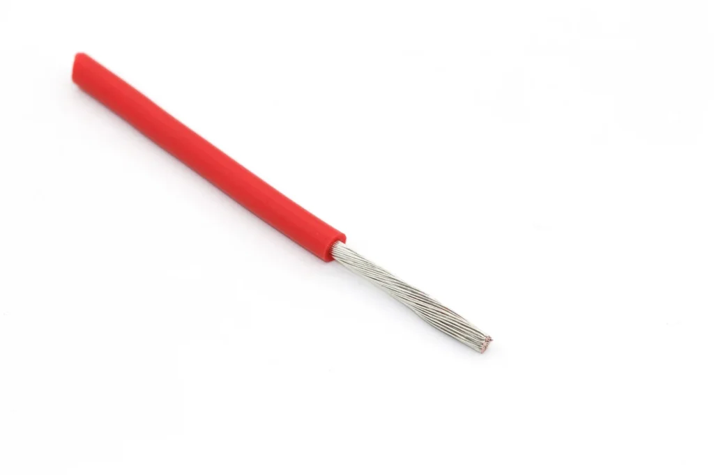 Straight red silicone wire sample with a long stripped conductor.