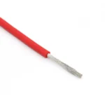 Straight red silicone wire sample with a long stripped conductor.