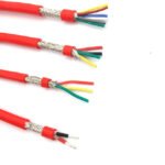 Red sheathed cable samples with exposed braided screens and coloured cores.
