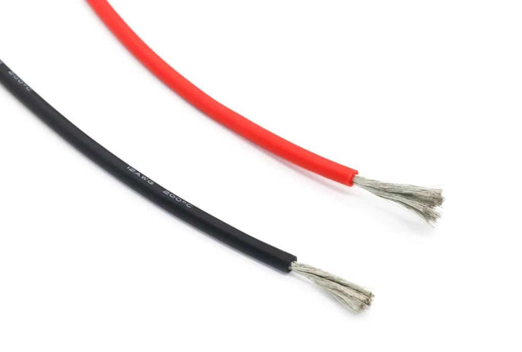 Red and black silicone wire samples with fine strands spread at the ends.