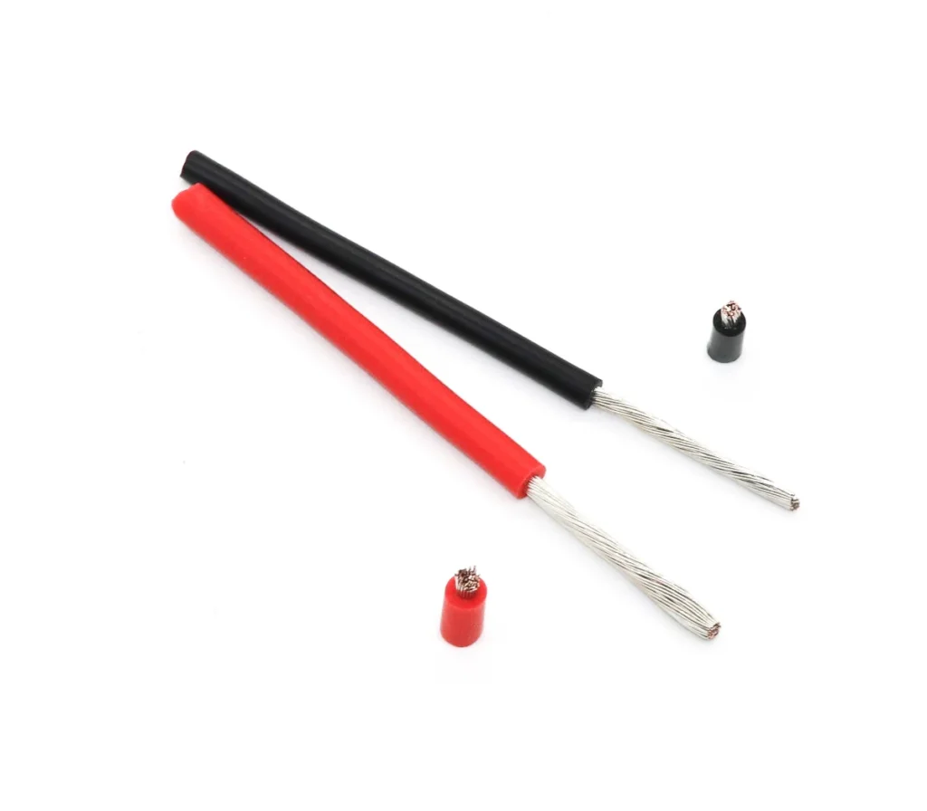 Red and black stripped wire samples beside their cut sections.